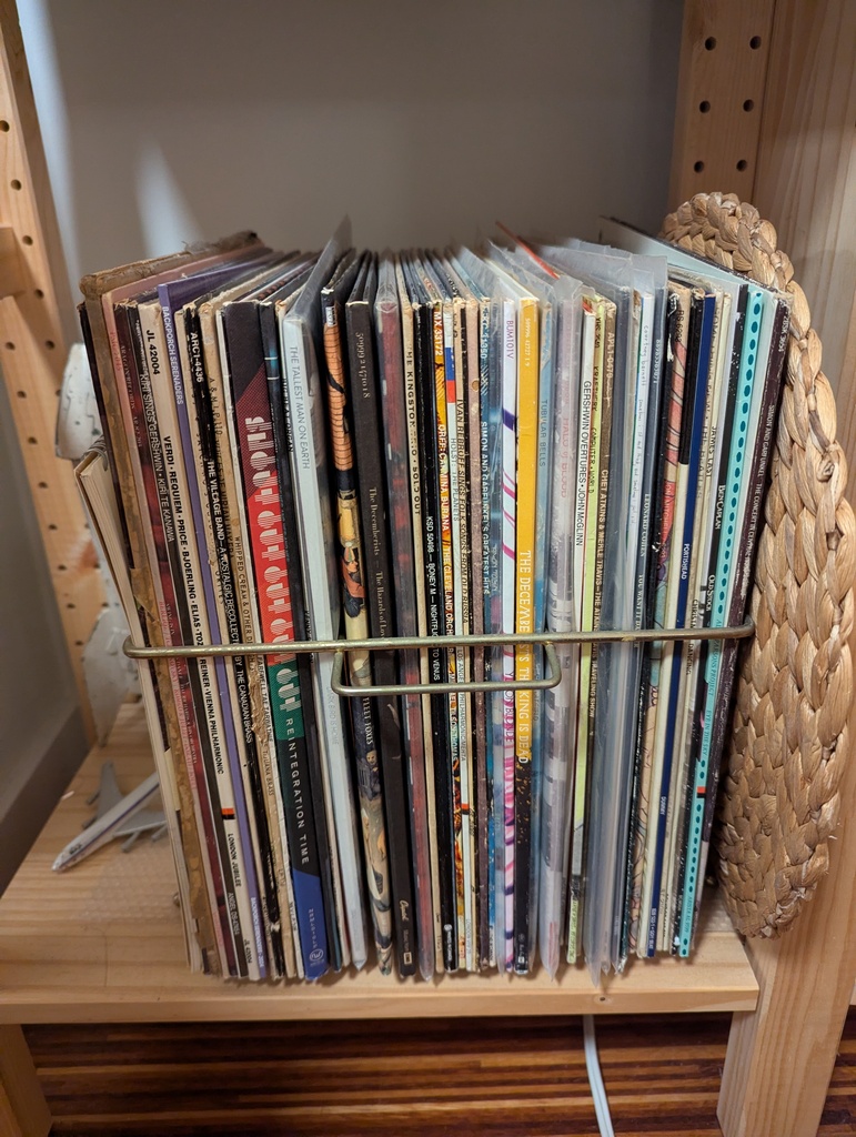Image is of the spines of a few dozen records