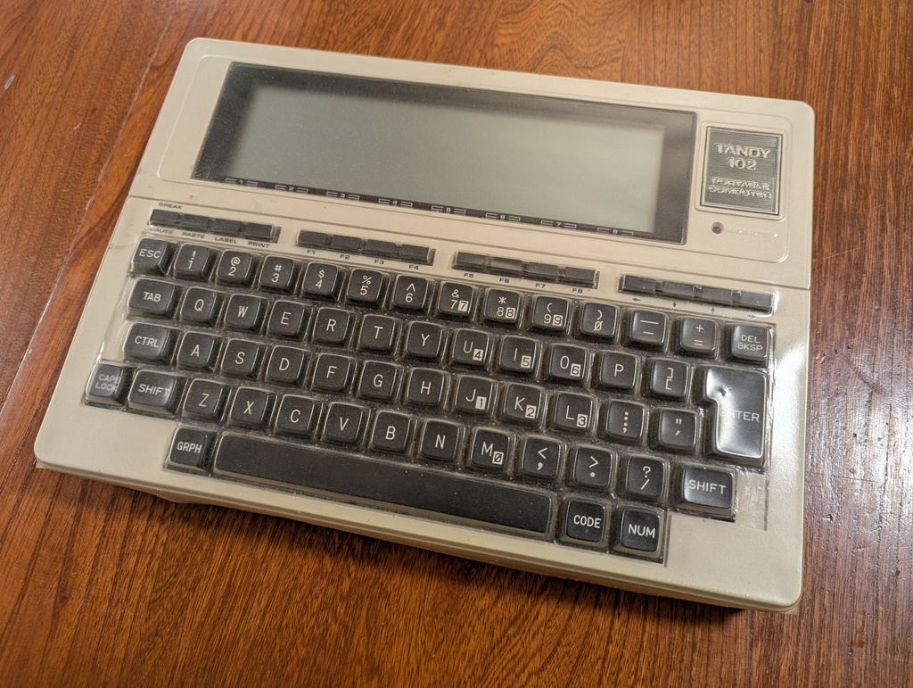 Image is of a Tandy 102 portable computer
